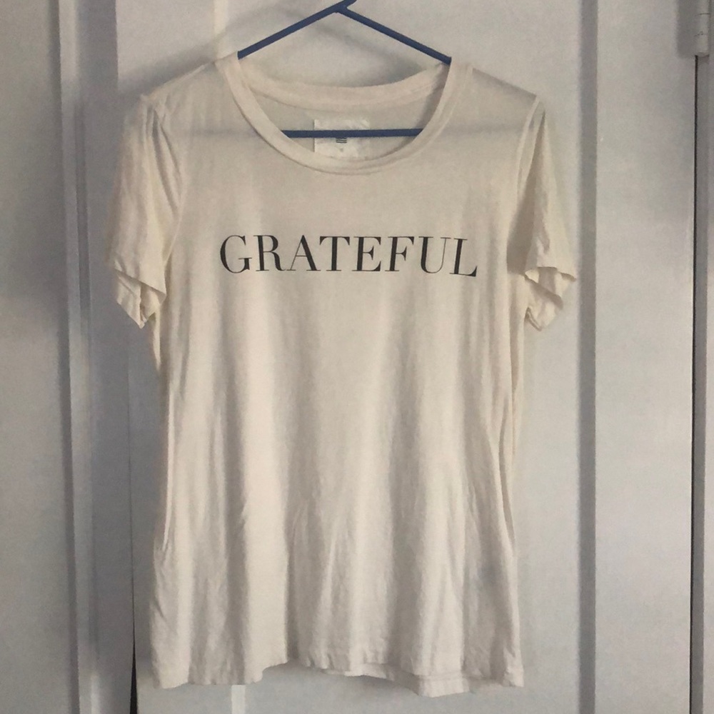 Graphic T-shirt, off white with black lettering. Size small
